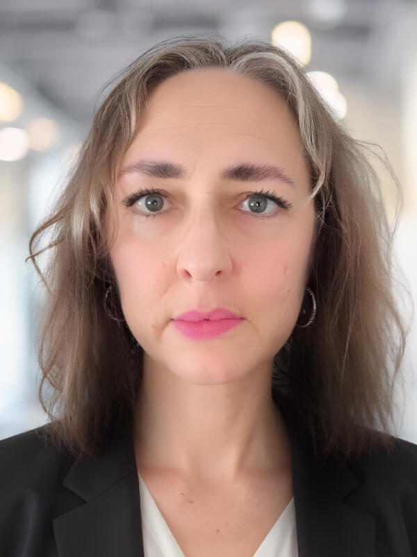 Professional headshot of Paula Sykora, Marketing and Communications Consultant.